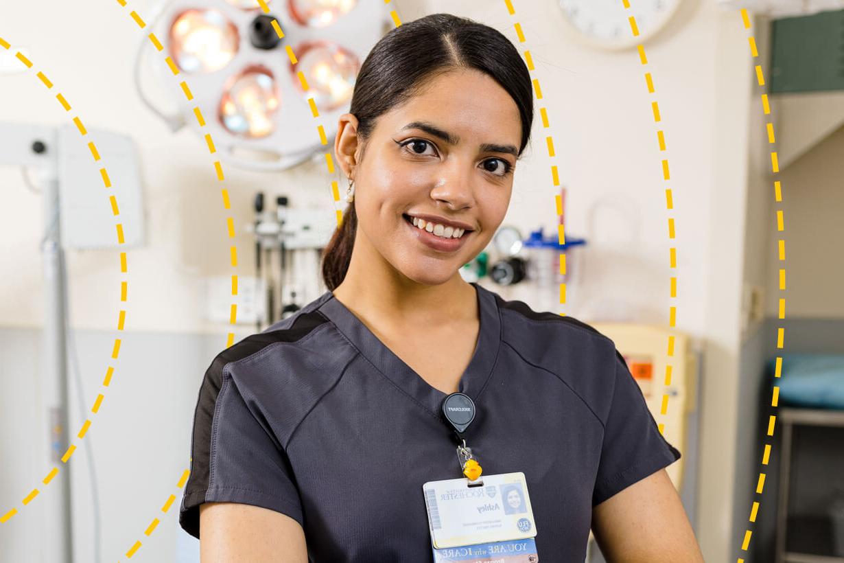 University of Rochester 工作人员 member poses for a photo in a hospital building.